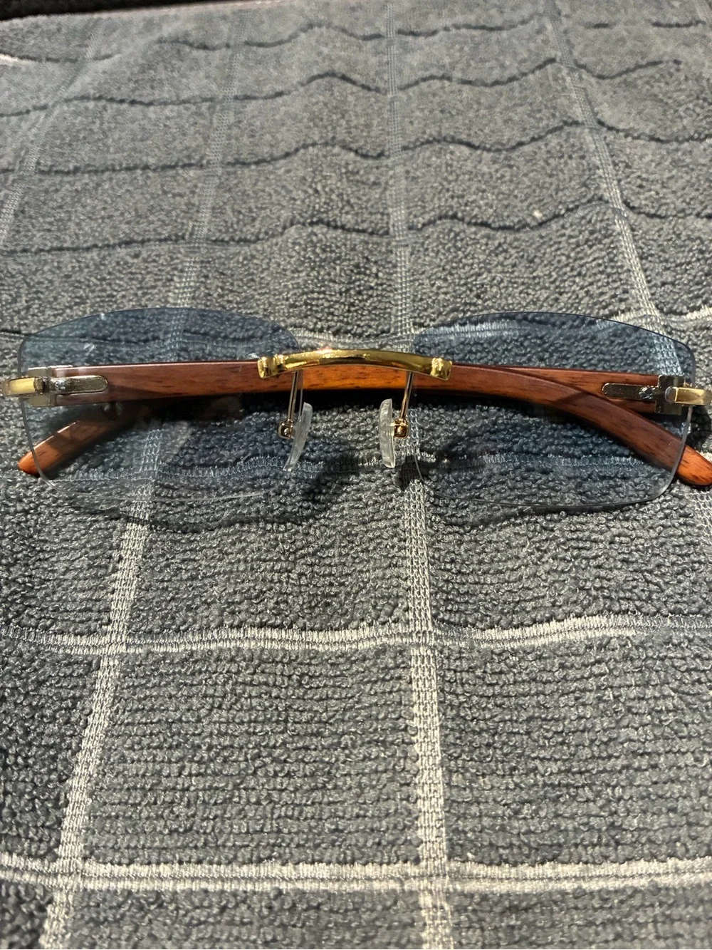 Rimless Blue Lens Sunglasses with Wood Arms and Gold Bridge